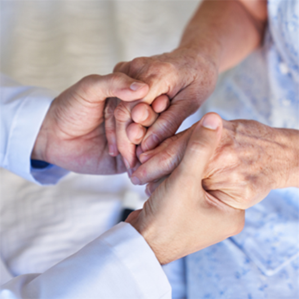 photo of two people holding hands