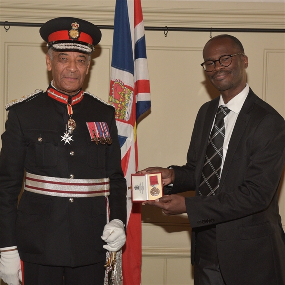 Photo of Matthew McKenzie receiving the British Empire Medal